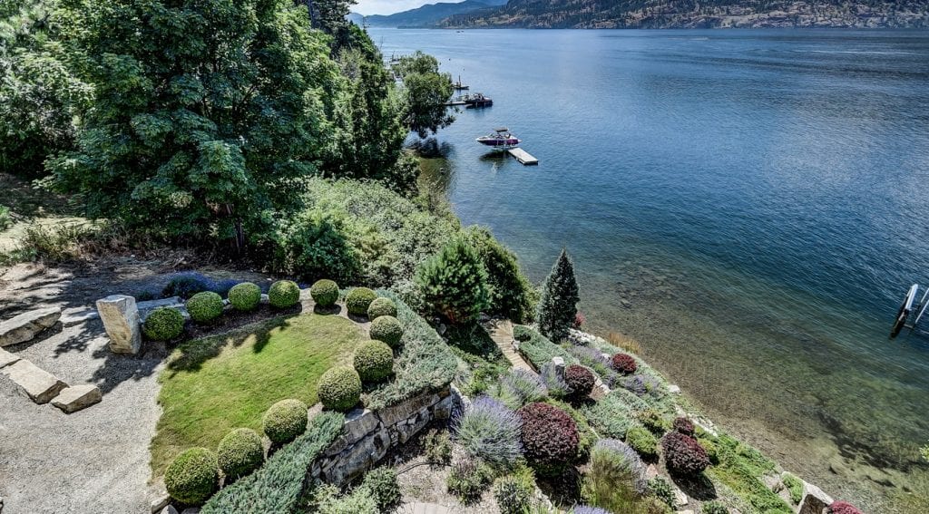 Luxury home landscape and view on lakefront property in Kelowna.